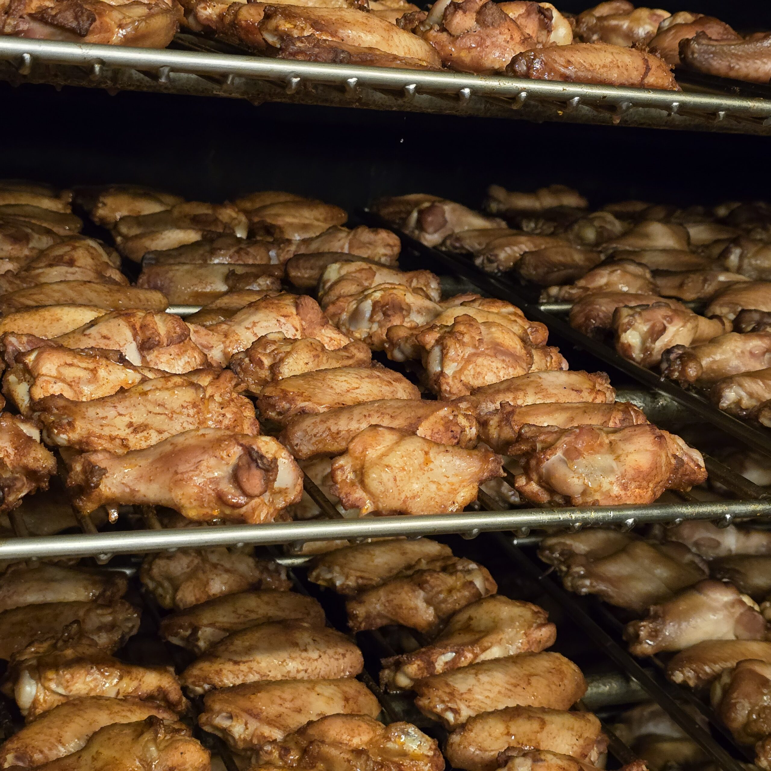 farm to table butcher smoking wings from a local farm