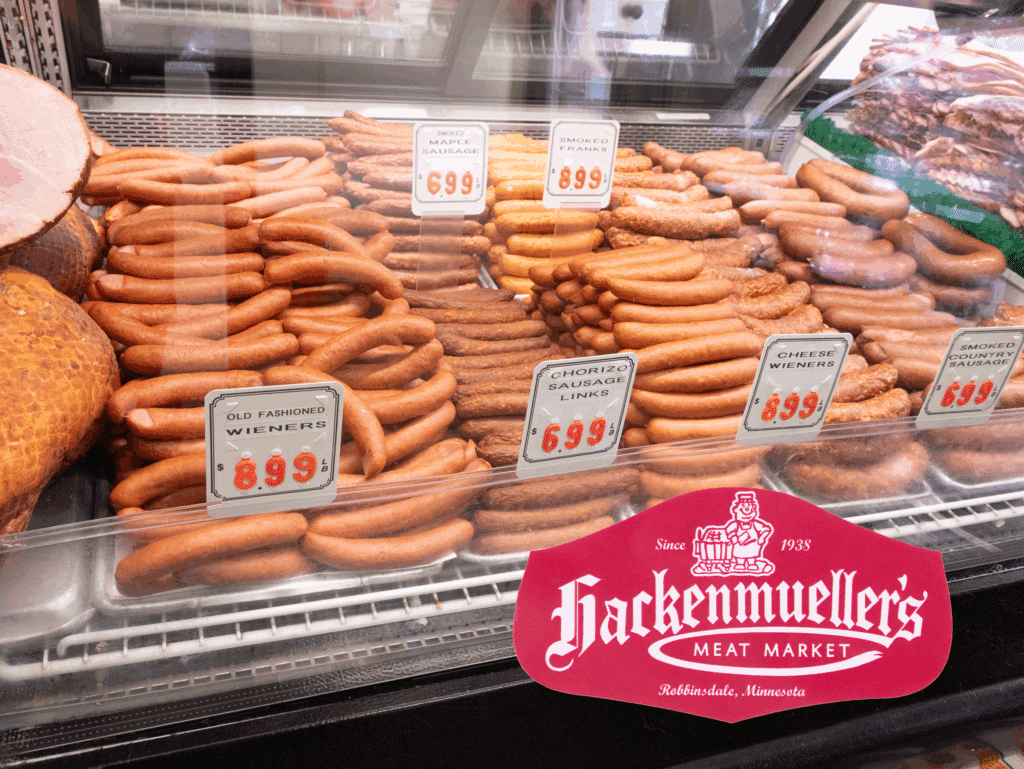 Sausage case with hackenmueller logo and prices
