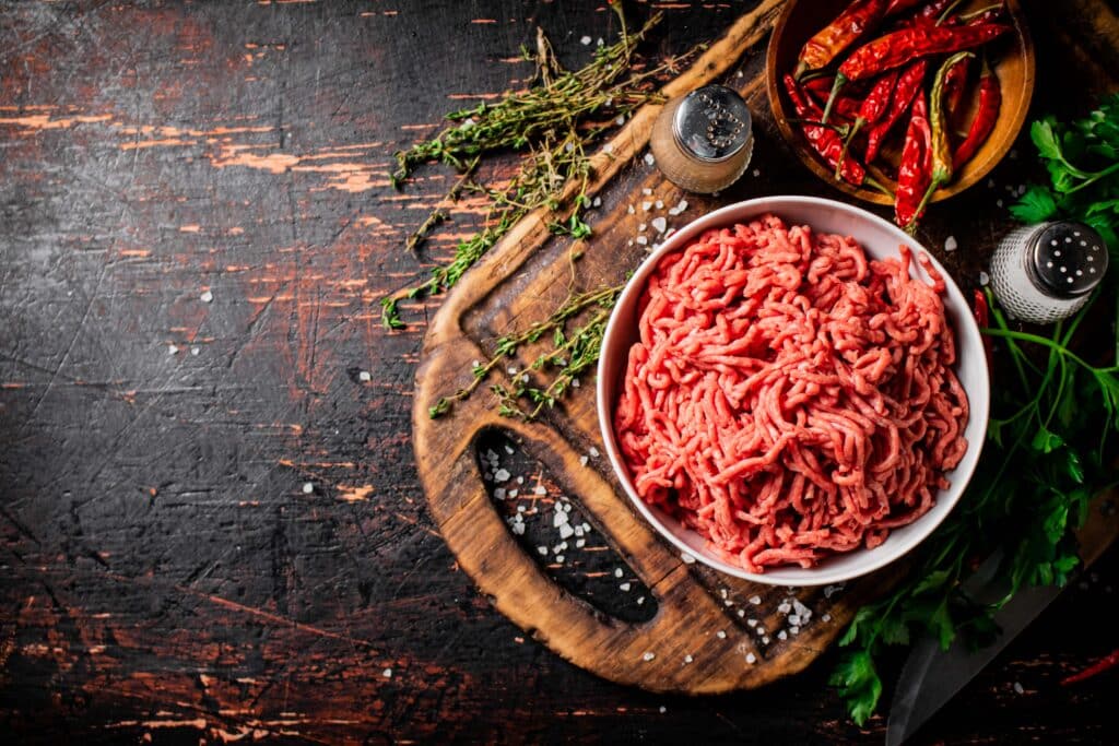 Fresh minced meat on a wooden cutting board at hackenmueller meats
